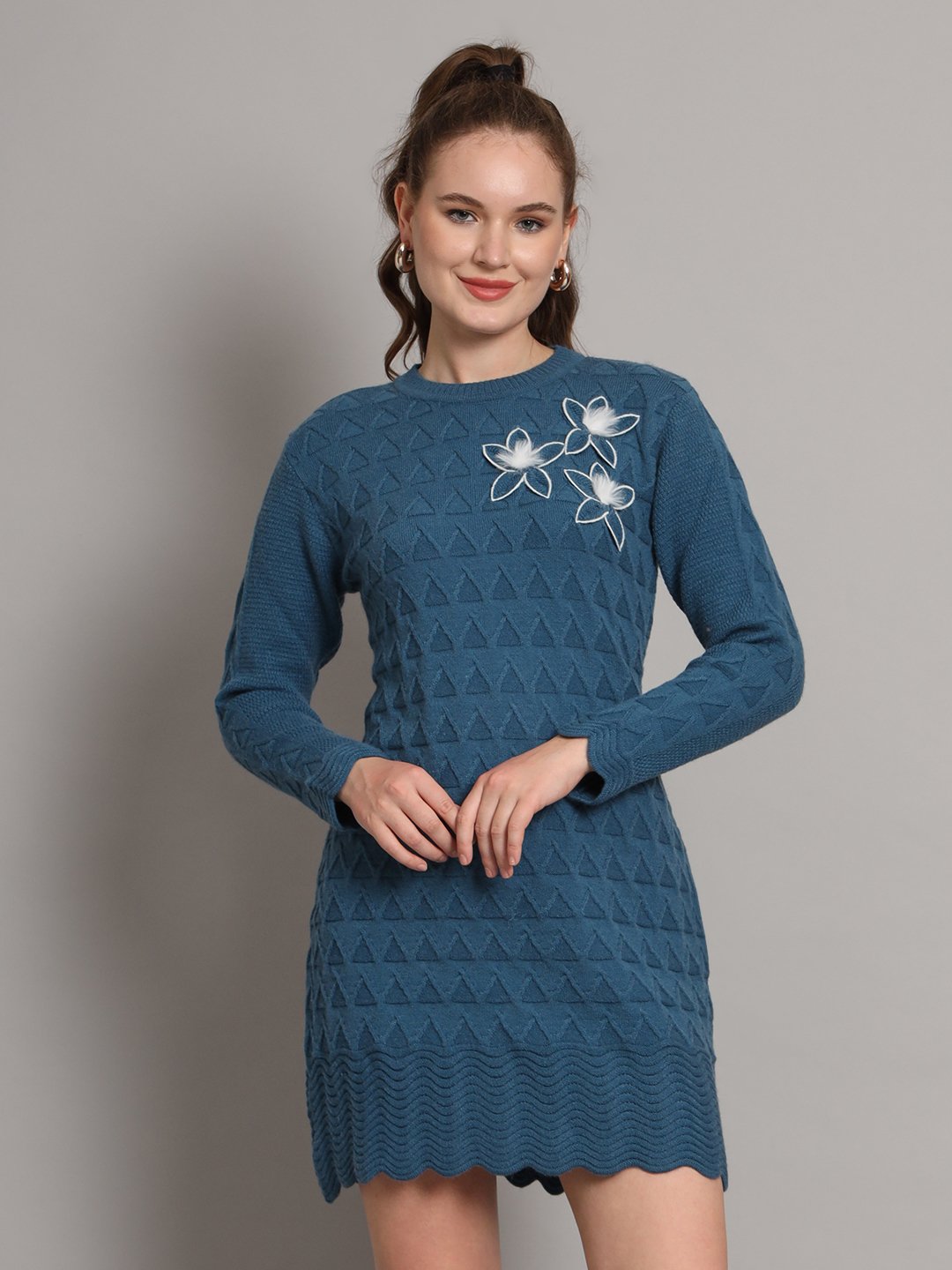 Women’s teal blue winter knitted sweater dress with long sleeves, scalloped hem, and floral appliqué detail
