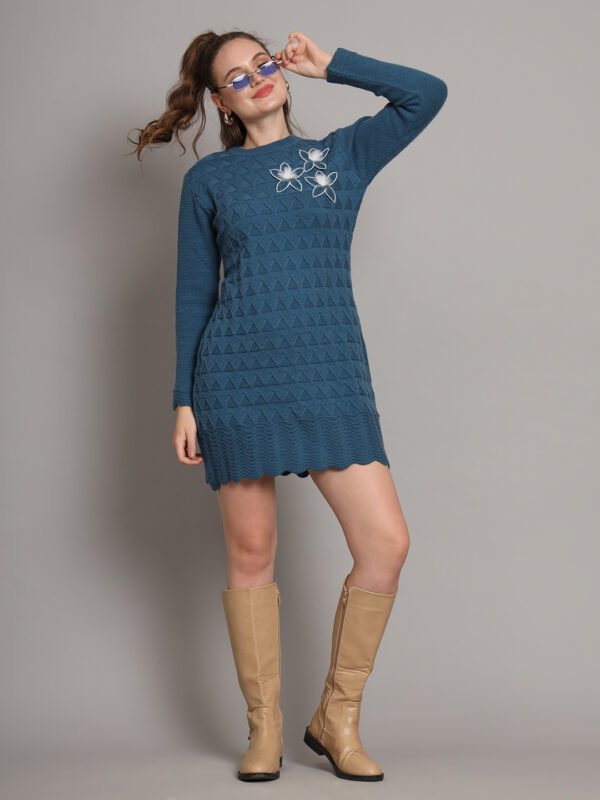 Women’s teal blue winter knitted sweater dress with long sleeves, scalloped hem, and floral appliqué detail