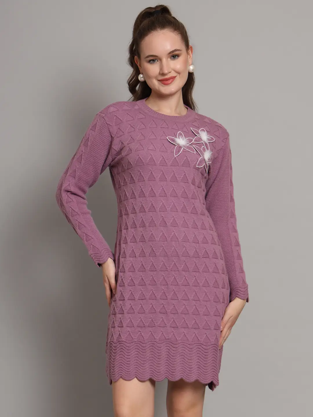 Women’s mauve purple winter knitted jumper dress with long sleeves, scalloped hem, and floral appliqué detail