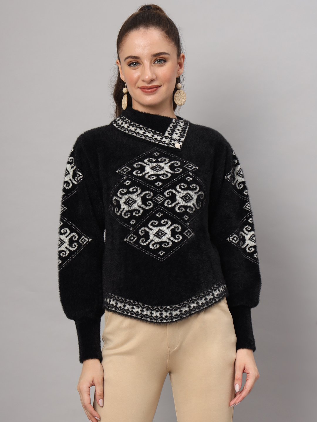 Black and white geometric pattern women’s short-length winter sweater top with asymmetric neckline and full sleeves