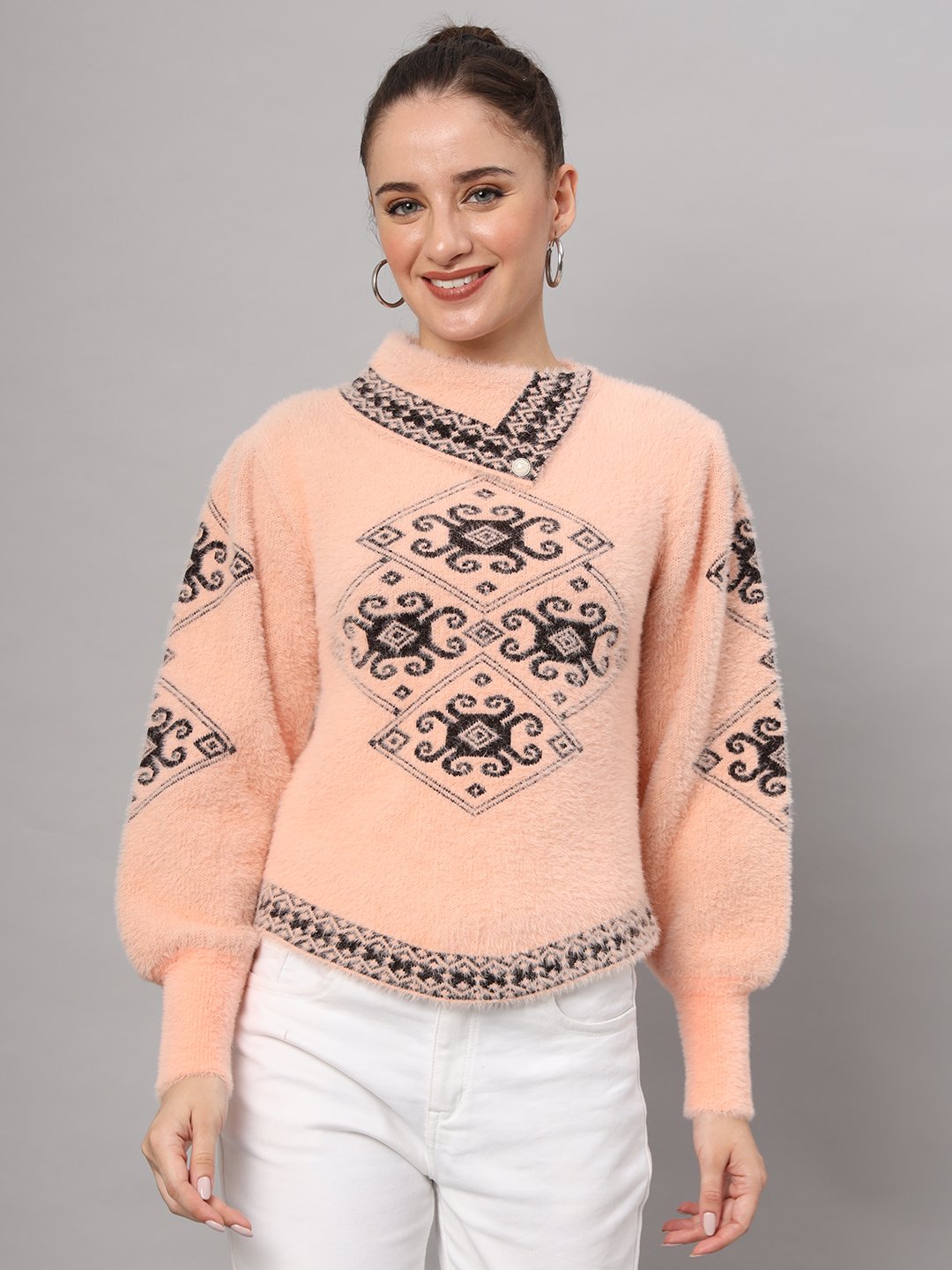 Peach women’s short-length winter sweater top with black ethnic pattern, asymmetric buttoned neckline, and full sleeves