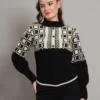 Women's black and ivory geometric Nordic cable knit short-length winter sweater top with ribbed high neck, buttons, and balloon sleeves