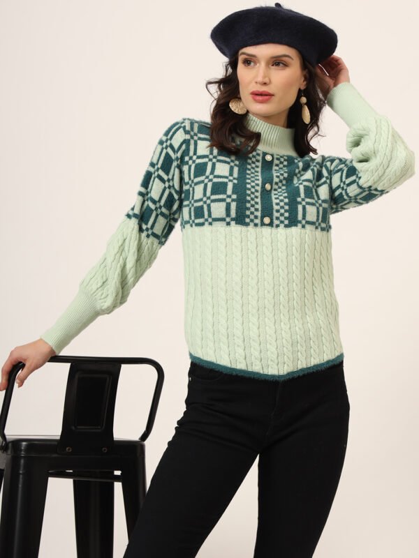 Women's pistachio and teal geometric cable knit short-length winter sweater top with ribbed high neck, pearl button detail, and balloon sleeves