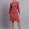 Woman wearing rose pink ribbed knit winter dress with scallop hem and collar, styled with ankle boots. Woman wearing rose pink ribbed knit winter dress with scallop hem and collar, styled with ankle boots.