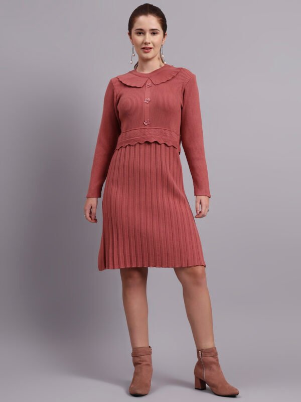 Woman wearing rose pink ribbed knit winter dress with scallop hem and collar, styled with ankle boots. Woman wearing rose pink ribbed knit winter dress with scallop hem and collar, styled with ankle boots.