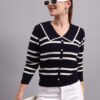 Woman wearing a navy and white striped knit cardigan with a large sailor collar and button front.