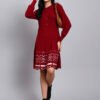 Woman in maroon knit winter dress with pink and white patterned hem, button front, and long sleeves