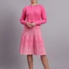 Women’s pink cable knit acrylic wool fit & flare jumper dress with pearl buttons and pleated skirt Women’s pink cable knit acrylic wool fit & flare jumper dress with pearl buttons and pleated skirt